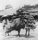 Korea: A farmer bringing firewood to market in the suburbs of old Seoul, near the South Gate, early 20th century
