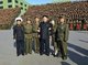 North Korea: Kim Jong Un (4th L) poses for a commemorative photo in Pyongyang on 23 October 2013 with participants in the 4th Meeting of KPA Company Commanders and Political Instructors